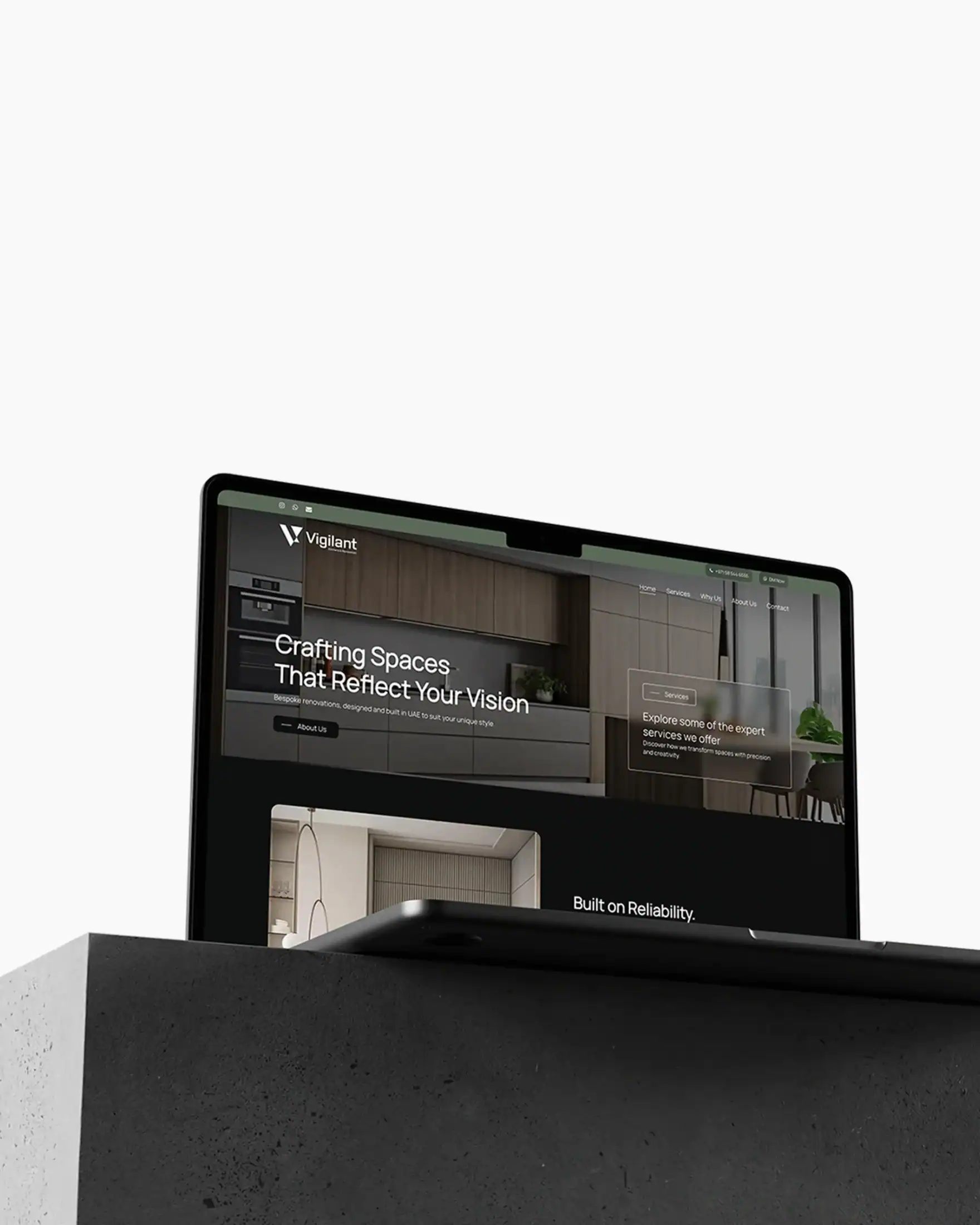 Corporate website homepage on a laptop